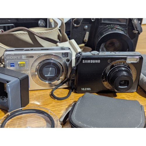 146 - Quantity of cameras and lenses including Zenith, Samsung, Olympus, Minolta etc