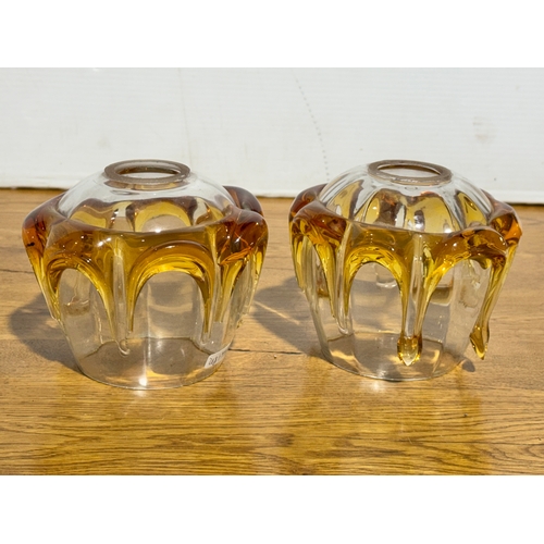 268 - A pair of vintage clear and amber glass lamp shades. 14x12cm.