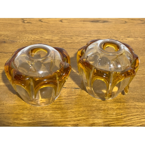 268 - A pair of vintage clear and amber glass lamp shades. 14x12cm.