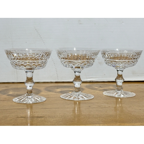 69 - A set of three Waterford Crystal Tramore champagne coupes. 10.7x11.5cm.