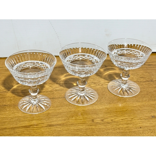 69 - A set of three Waterford Crystal Tramore champagne coupes. 10.7x11.5cm.