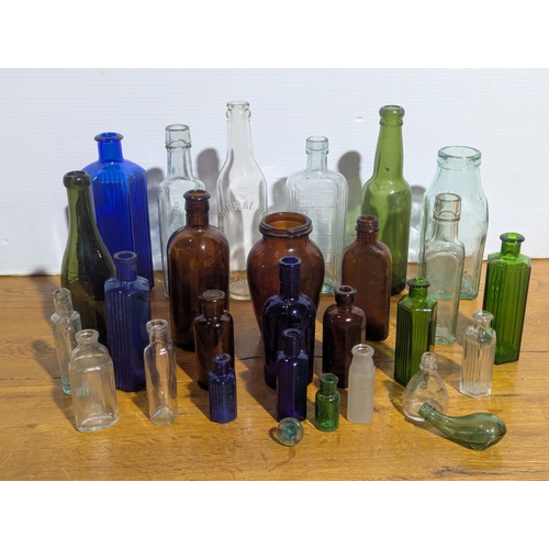 72 - Quantity of vintage glass bottles and jars