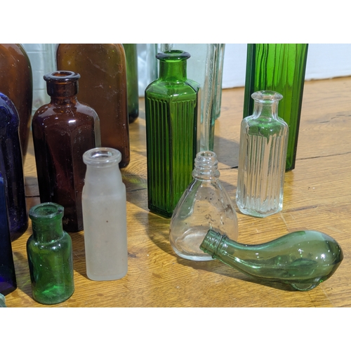 72 - Quantity of vintage glass bottles and jars