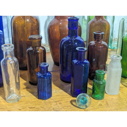72 - Quantity of vintage glass bottles and jars