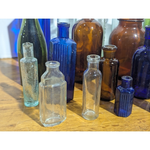 72 - Quantity of vintage glass bottles and jars