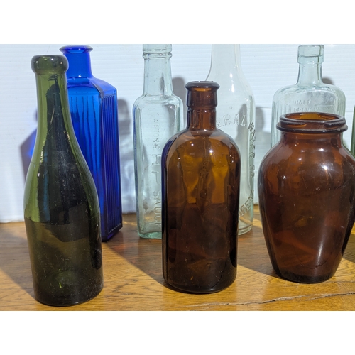 72 - Quantity of vintage glass bottles and jars