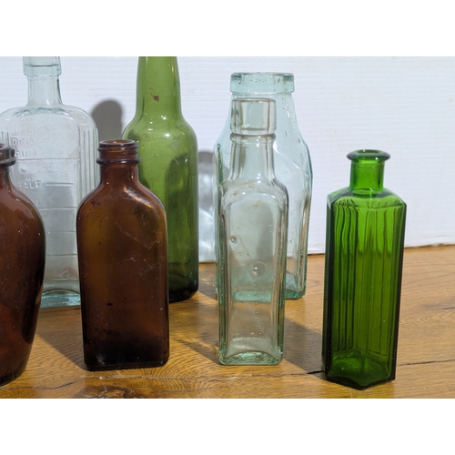 72 - Quantity of vintage glass bottles and jars