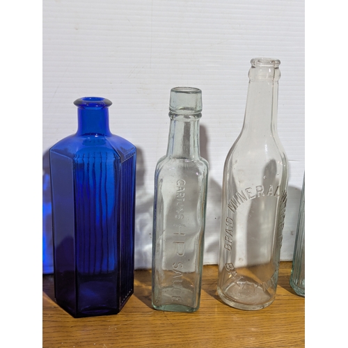 72 - Quantity of vintage glass bottles and jars