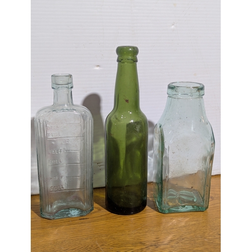 72 - Quantity of vintage glass bottles and jars