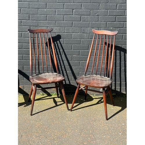 273 - A pair of Ercol Goldsmith dining chairs.
