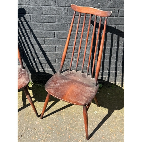 273 - A pair of Ercol Goldsmith dining chairs.