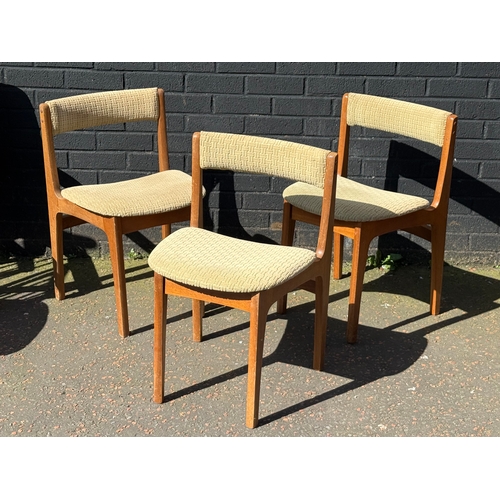 274 - A set of three Nathan teak tuck away dining chairs.