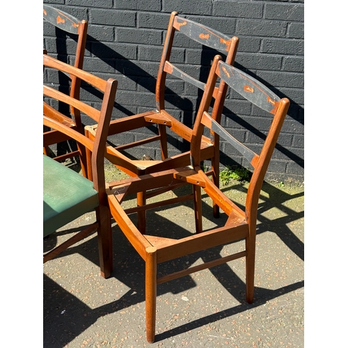 276 - A quantity of mid century dining chairs for restoration.