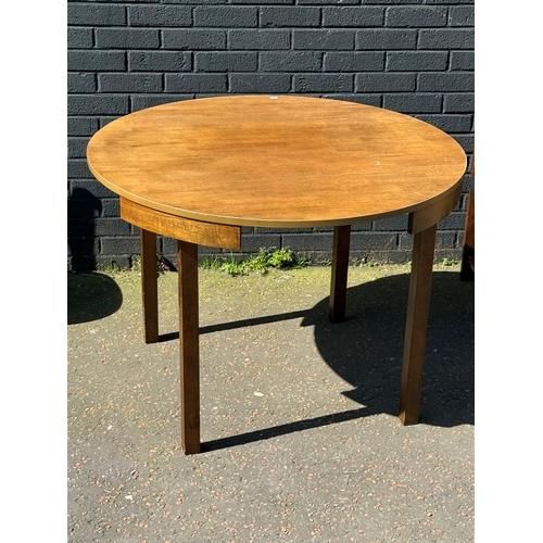 123 - A tuck away table and four chairs. 105x76cm.