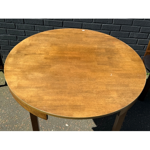 123 - A tuck away table and four chairs. 105x76cm.