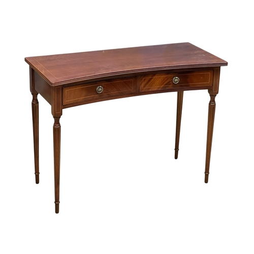 74 - A Georgian style inlaid mahogany concave side table. 99x43x74cm.