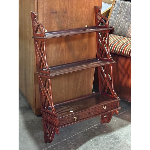 289 - A mahogany wall bracket with 3 shelves and 2 drawers. 54x22x91cm