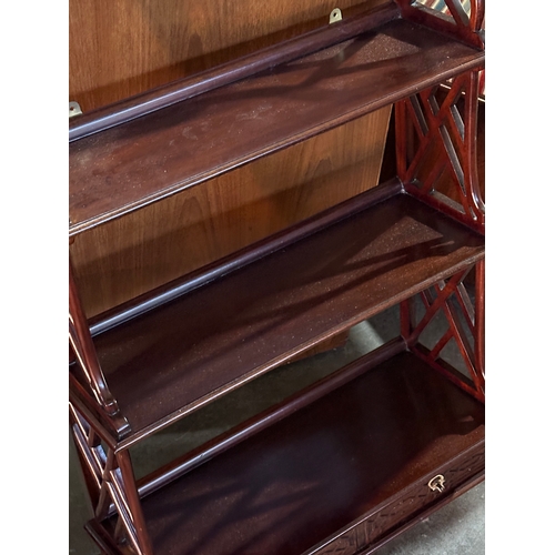 289 - A mahogany wall bracket with 3 shelves and 2 drawers. 54x22x91cm