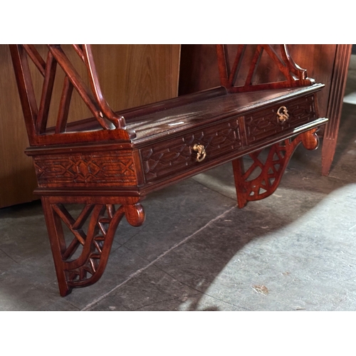 289 - A mahogany wall bracket with 3 shelves and 2 drawers. 54x22x91cm