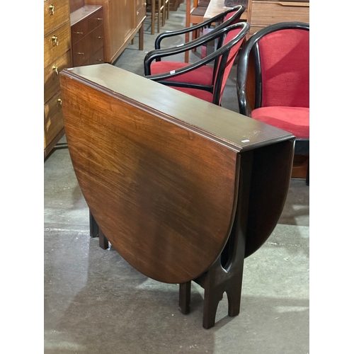 290 - A Jentique drop leaf dining table. 1960-70.