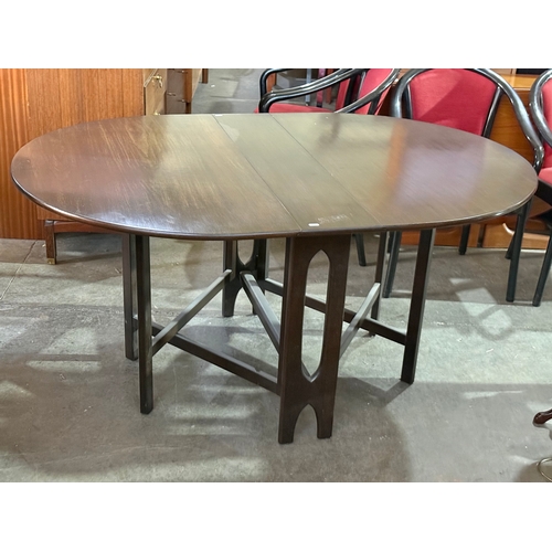 290 - A Jentique drop leaf dining table. 1960-70.
