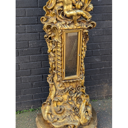 63 - Gilt cherub grandfather clock, 200cm