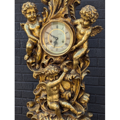 63 - Gilt cherub grandfather clock, 200cm