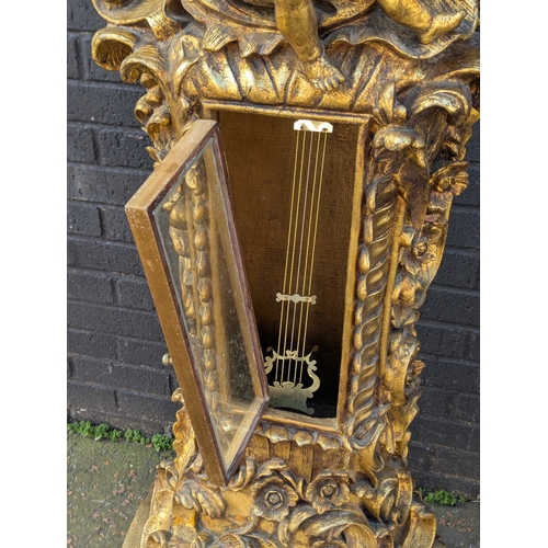 63 - Gilt cherub grandfather clock, 200cm