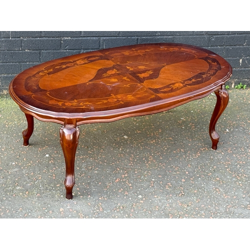294 - An inlaid coffee table. 115x63x43cm.