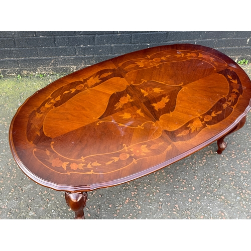 294 - An inlaid coffee table. 115x63x43cm.