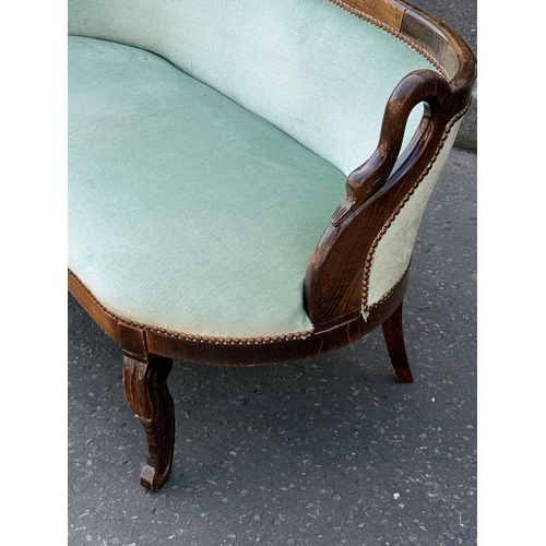 76 - A French style sofa. 133cm