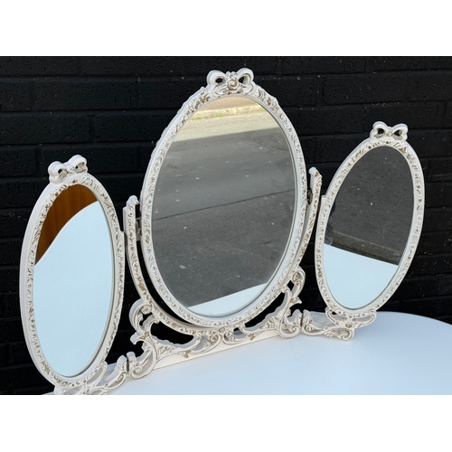77 - A vintage French style dressing table. 132x52x140cm.