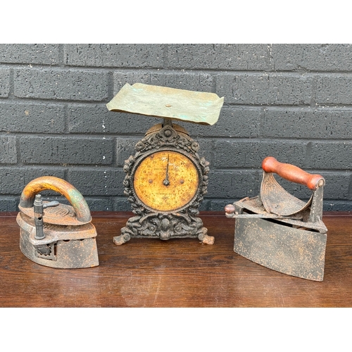 296 - Cast iron scales and irons.