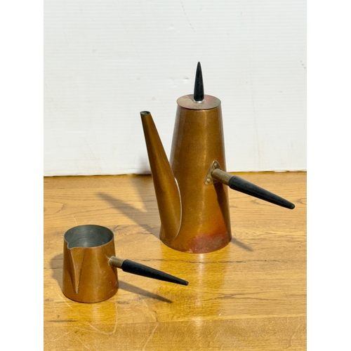 395 - A vintage two piece copper coffee service by Argv.