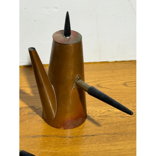 395 - A vintage two piece copper coffee service by Argv.