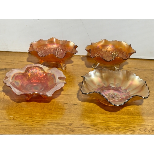 396 - Four carnival glass bowls.