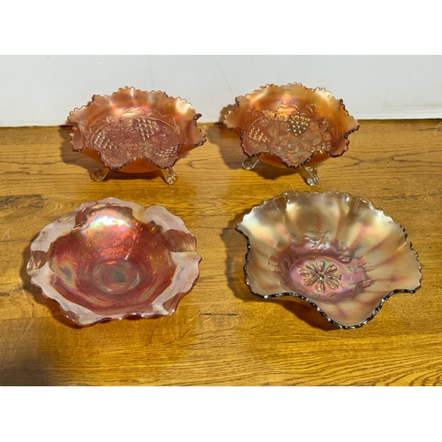 396 - Four carnival glass bowls.