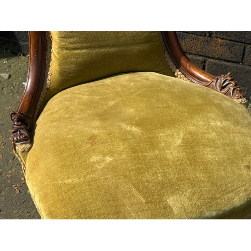 102 - A Victorian walnut ladies chair