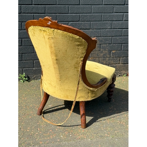 102 - A Victorian walnut ladies chair
