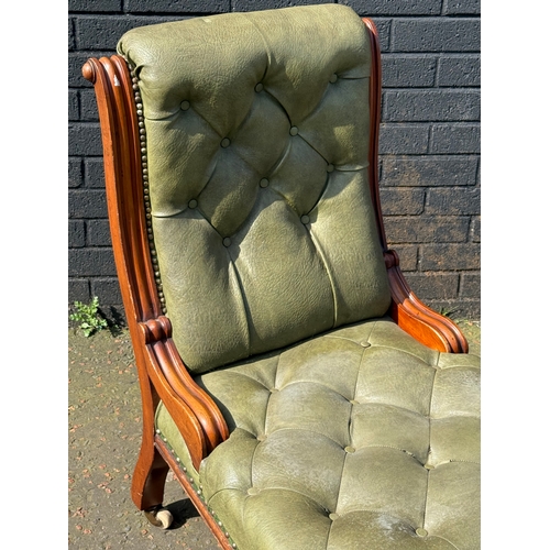 64 - A Victorian mahogany deep buttoned roll back chair