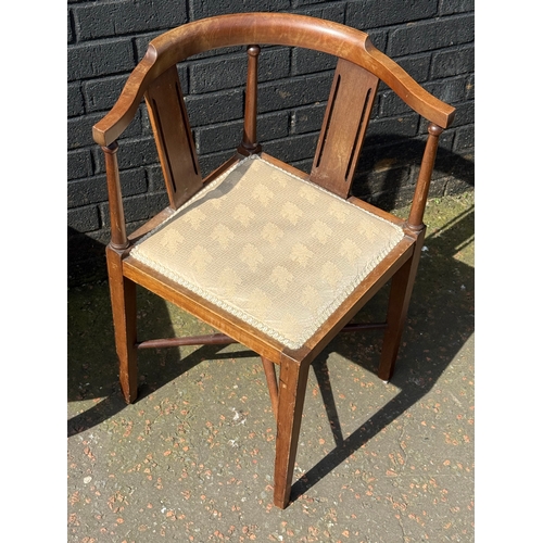 128 - An Edwardian mahogany corner armchair