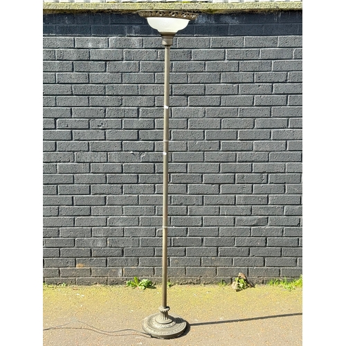 397 - An uplighter with glass shade.
