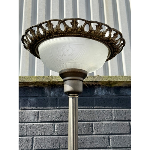 397 - An uplighter with glass shade.