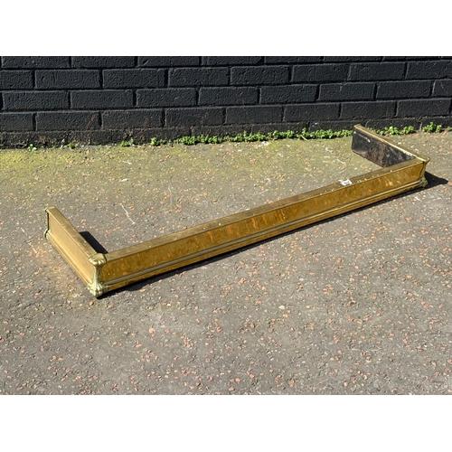 398 - An Edwardian brass fender.
