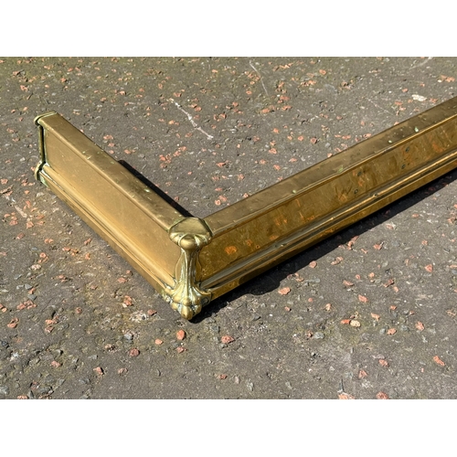 398 - An Edwardian brass fender.