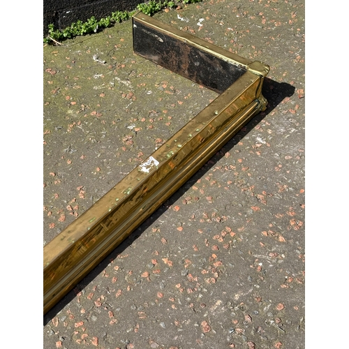398 - An Edwardian brass fender.