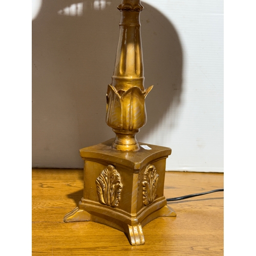 399 - A gilt table lamp. 73cm