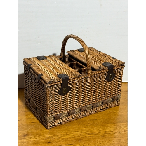 248 - A wicker picnic basket. 52x33x43cm.