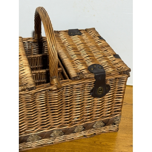248 - A wicker picnic basket. 52x33x43cm.