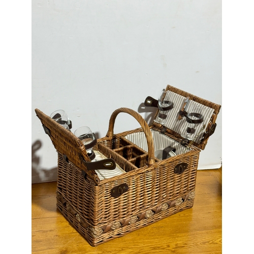 248 - A wicker picnic basket. 52x33x43cm.